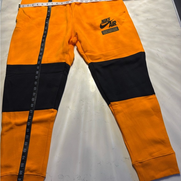 Nike Air Orange and Black Joggers - Picture 1 of 3